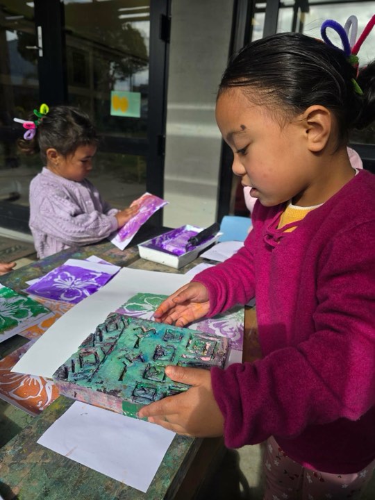 Children making colourful artwork together